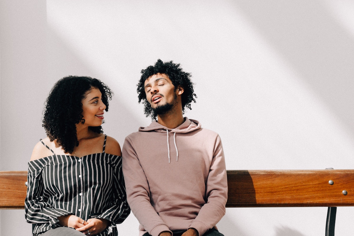 Couple talking on a bench